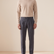 Model wearing The Pembroke pleated trousers, front view