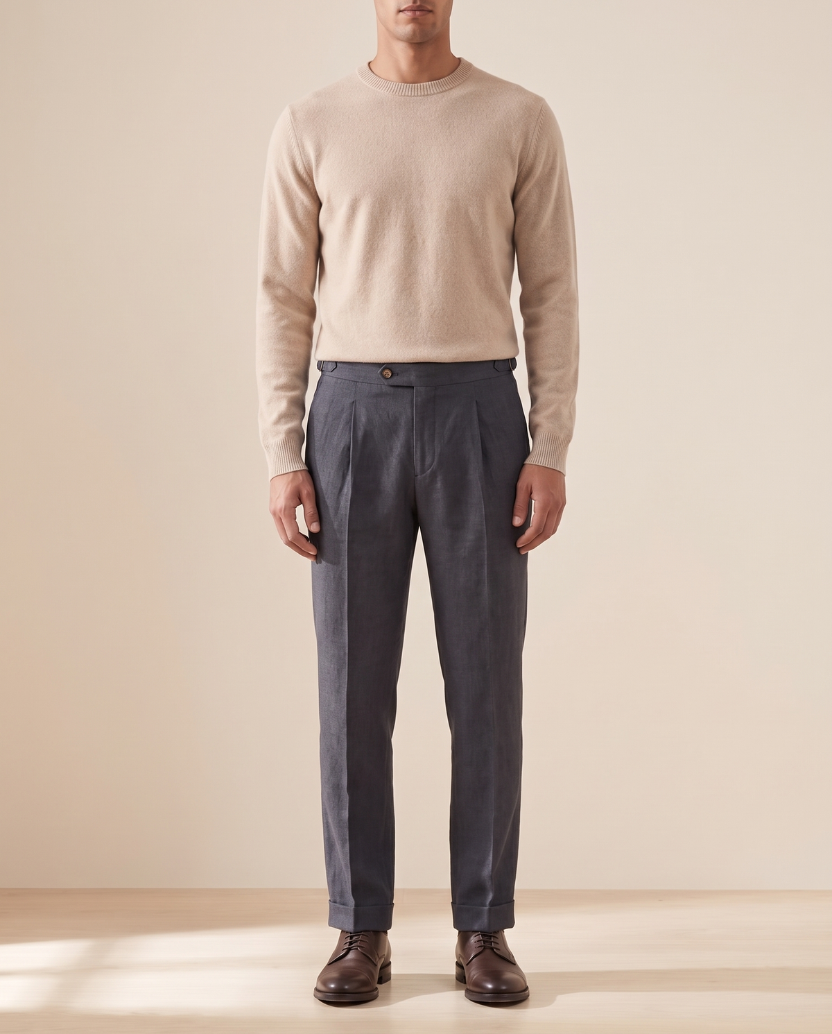 Model wearing The Pembroke pleated trousers, front view