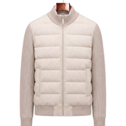Cream hybrid bomber with quilted body and ribbed knit sleeves, front view on hanger
