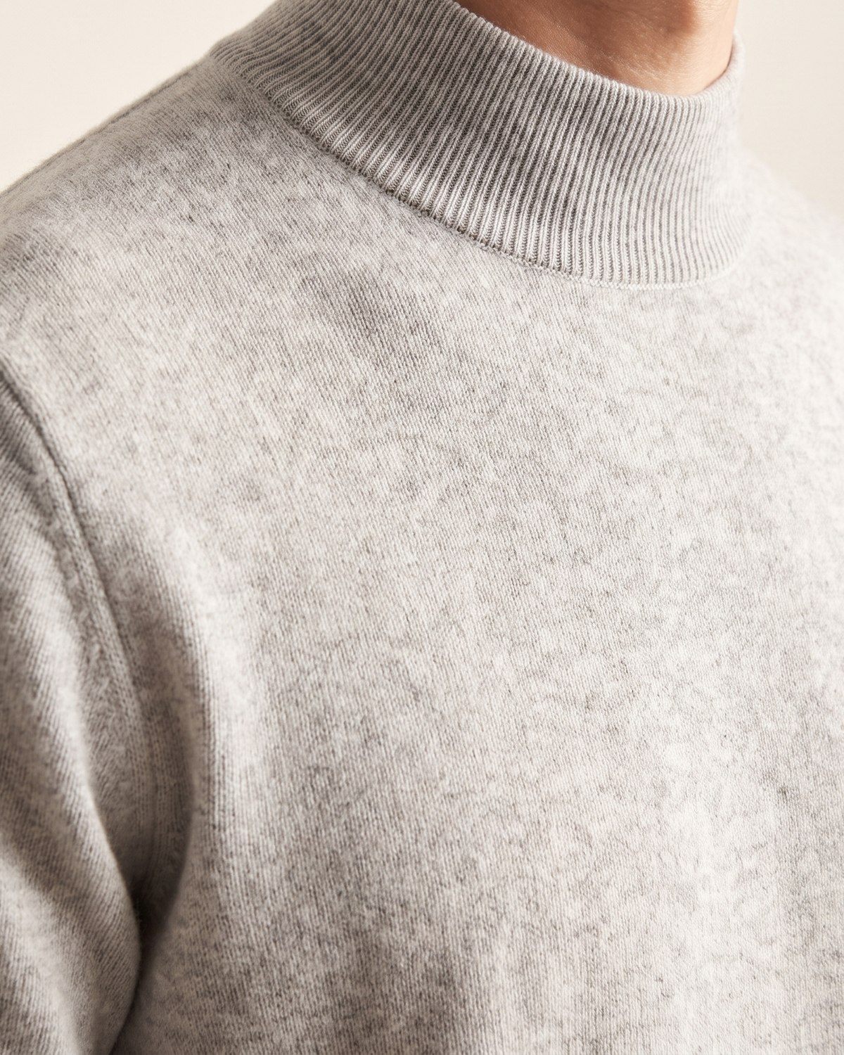 Close-up of the ribbed mock neck on The Denby