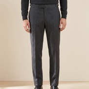 Model wearing The Wentworth charcoal wool dress trousers, front view from the chest down