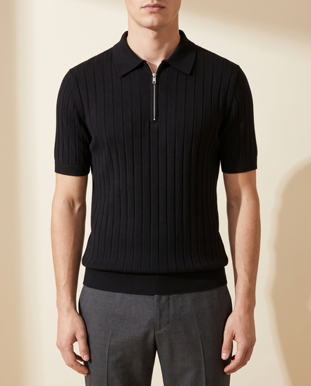 The Osborne ribbed zip polo in black, front view on model