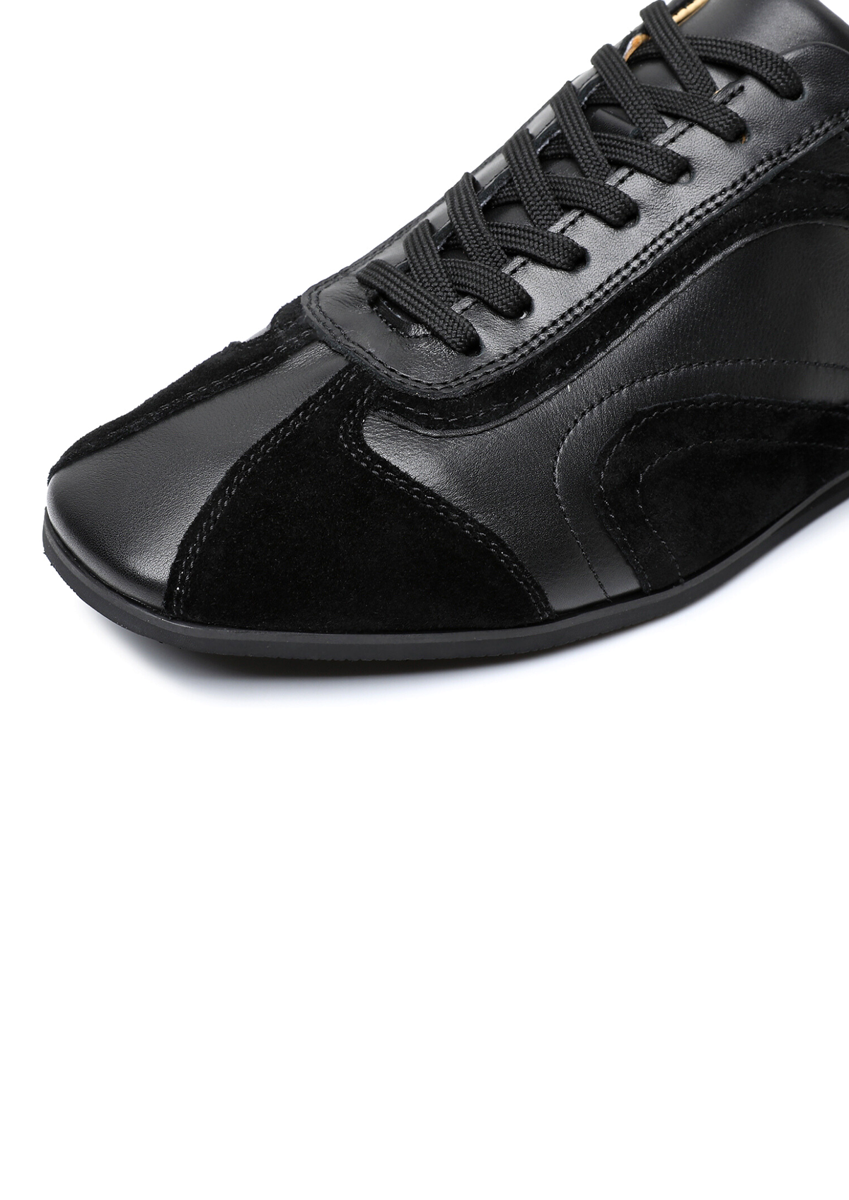 Close-up of the suede side panel on The Cadogan trainer