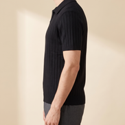 The Osborne ribbed zip polo in black, side profile on model