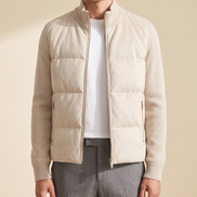 Model wearing the cream hybrid bomber, front view