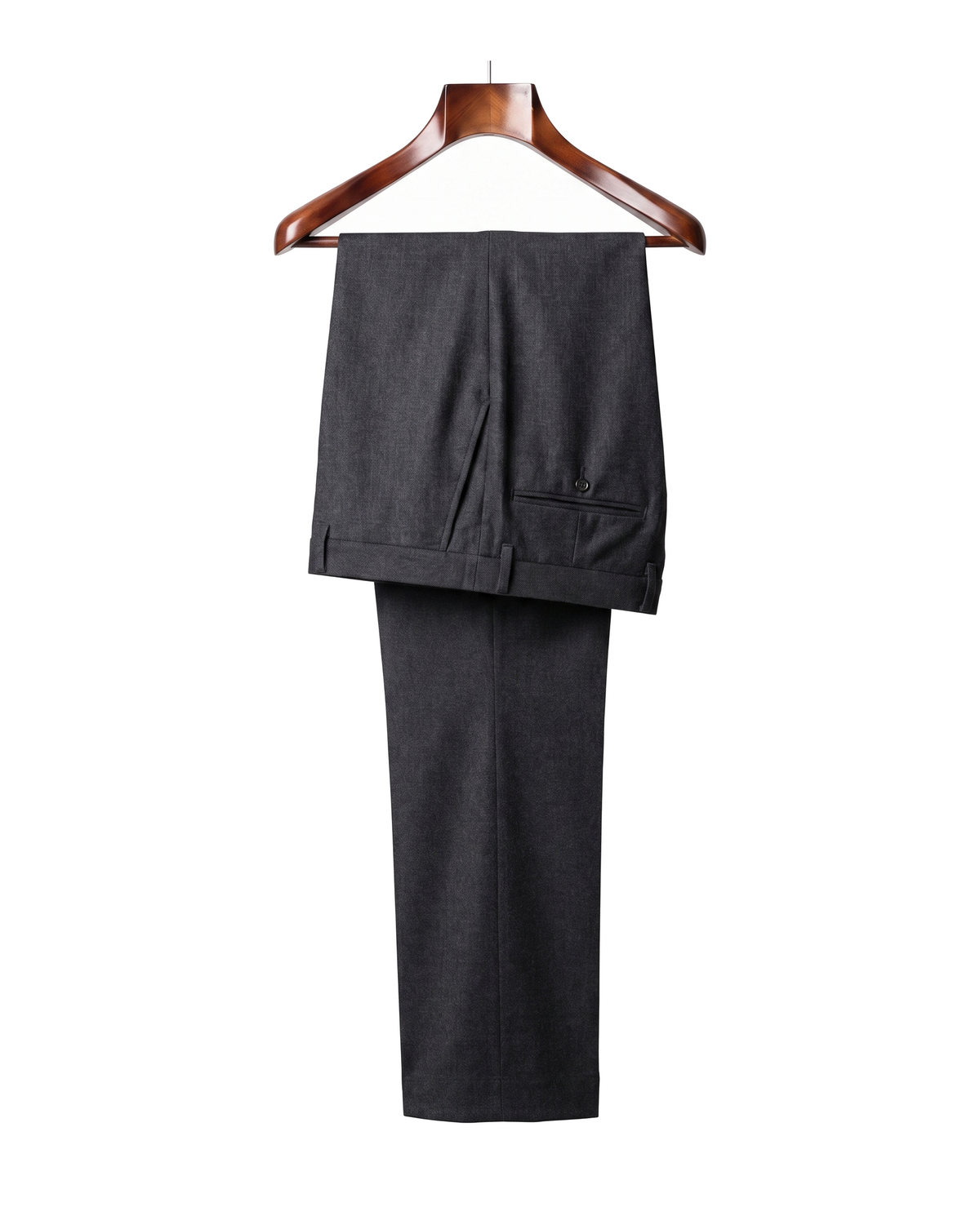 The Wentworth wool dress trousers in charcoal grey, back view on a mahogany hanger
