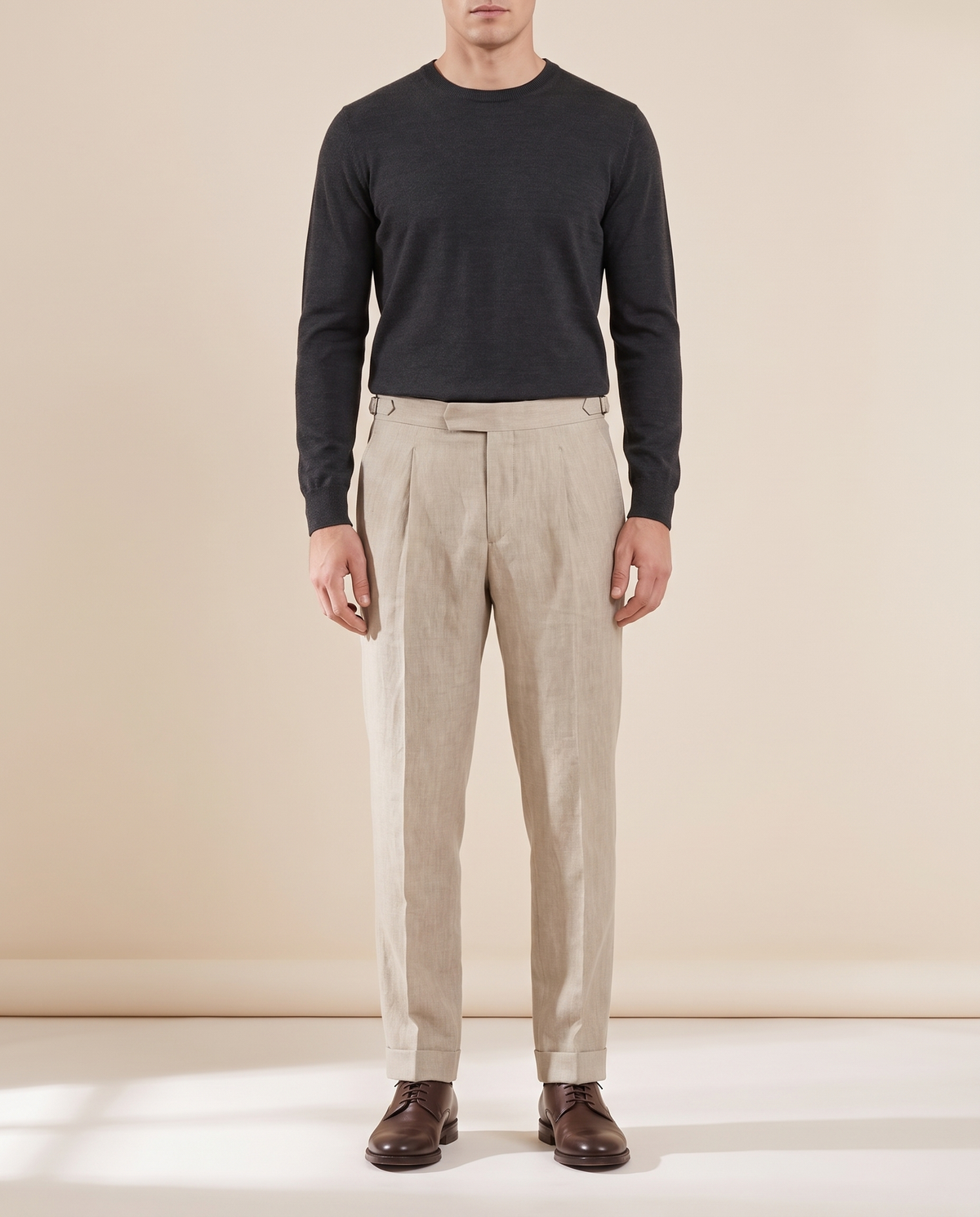 Model wearing The Somerset pleated linen trousers, front view