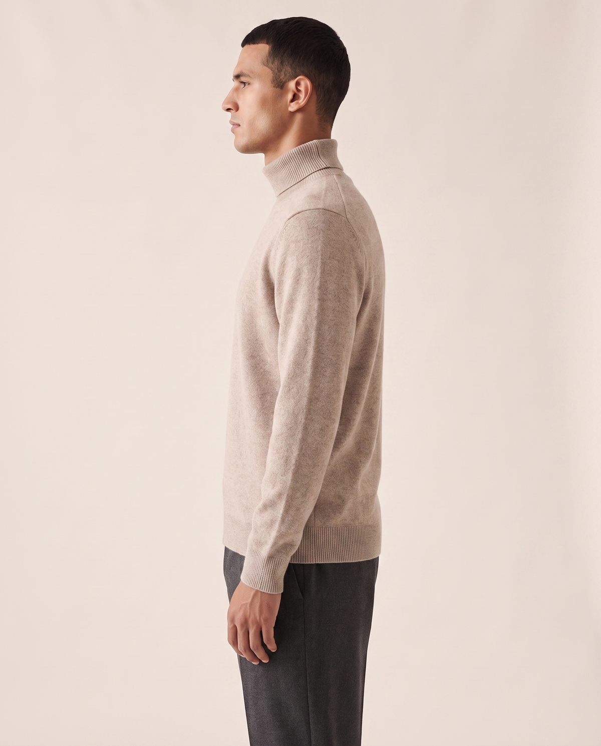 The Langham merino rollneck shown in side profile