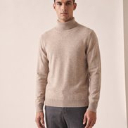 Model wearing The Langham merino rollneck jumper, front view