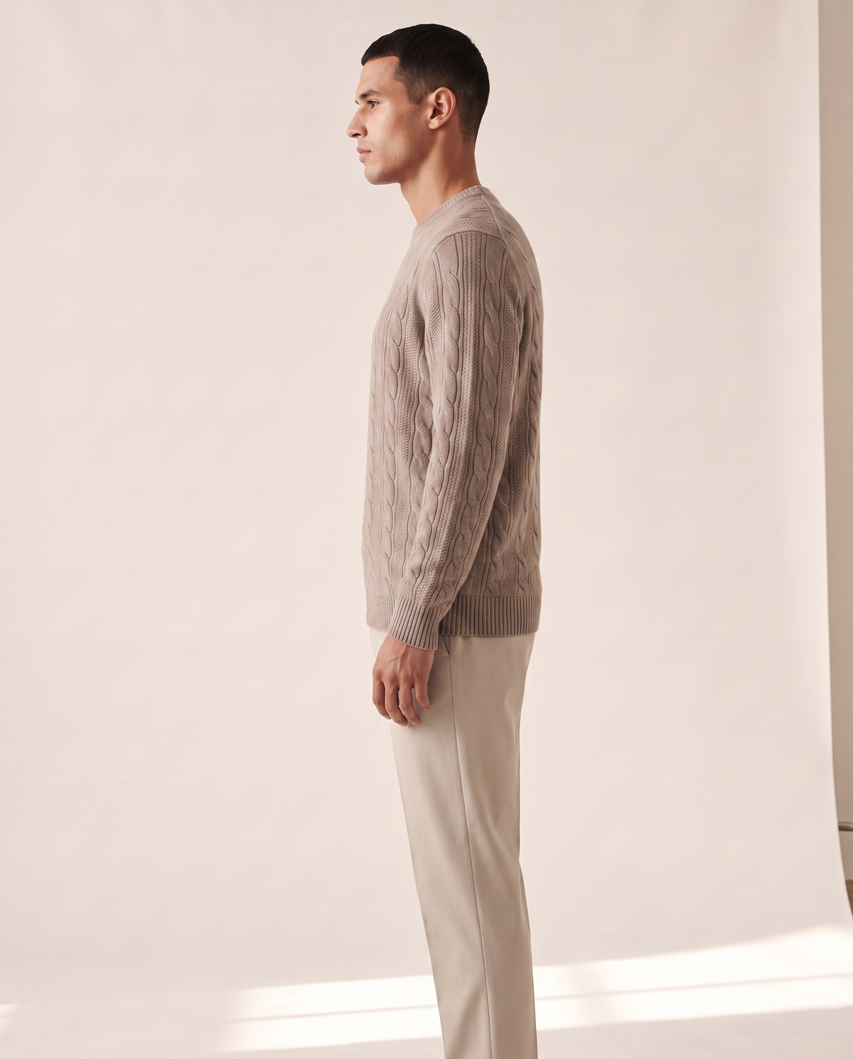 The Malvern cable crewneck shown in side profile