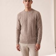 Model wearing The Malvern merino cable crewneck, front view