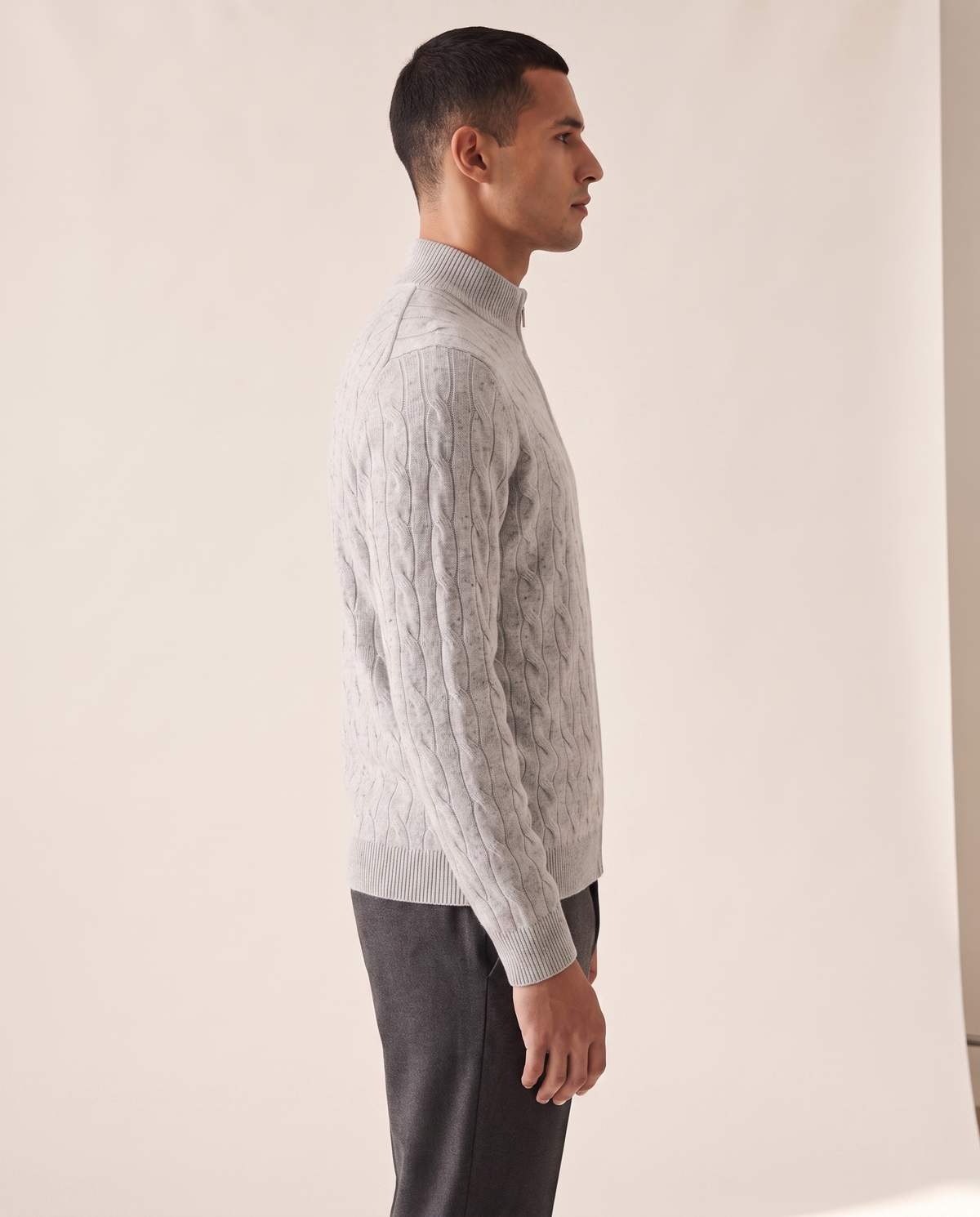 The Ashford cable-knit half-zip shown in side profile