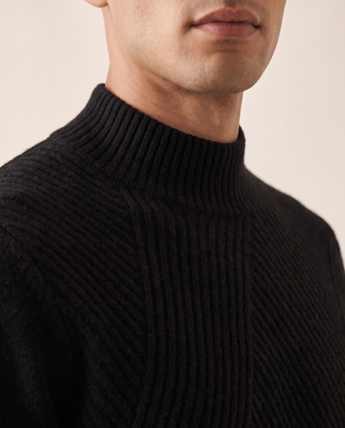 Close-up of the mock neck collar and tonal knit on The Grosvenor