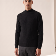 Model wearing The Grosvenor cashmere mock neck jumper, front view