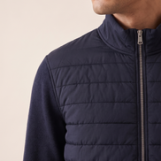 Close-up of the quilting and knitted sleeve seam on The Kensington