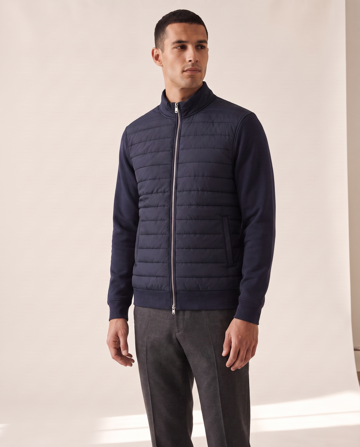 Model wearing The Kensington quilted knit hybrid jacket, front view