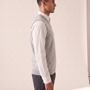 The Rutland merino vest shown in side profile over a white shirt