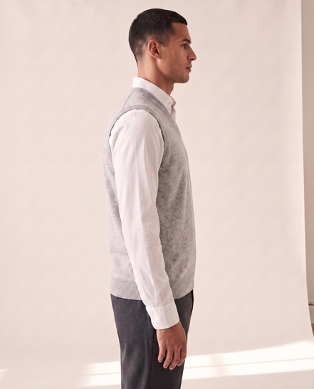 The Rutland merino vest shown in side profile over a white shirt
