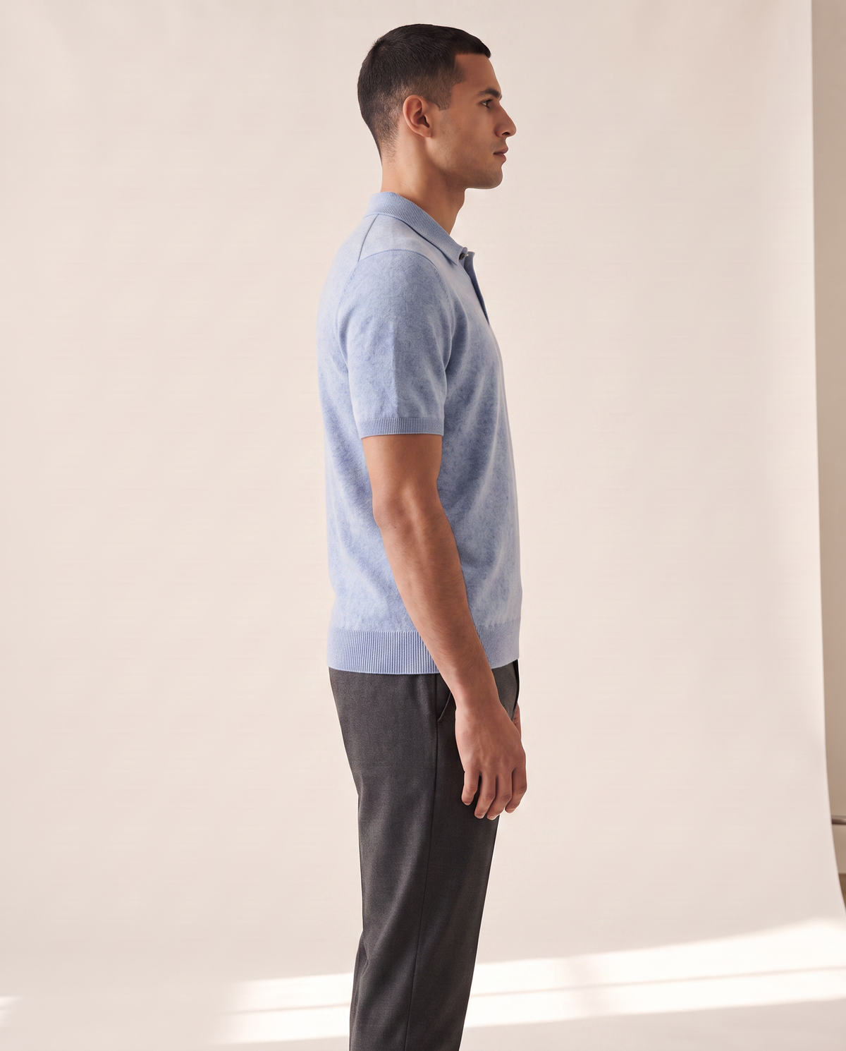 The Belgrave cashmere knit polo shown in side profile