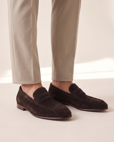 The Hampton penny loafers worn without socks with stone trousers