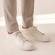 The Stanmore leather sneakers worn with stone trousers
