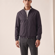 Model wearing The Sterling technical windbreaker, front view