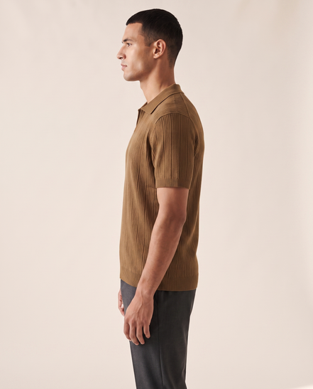 The Henley knit polo shown in side profile