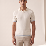 Model wearing The Radley ribbed knit polo in ivory, front view