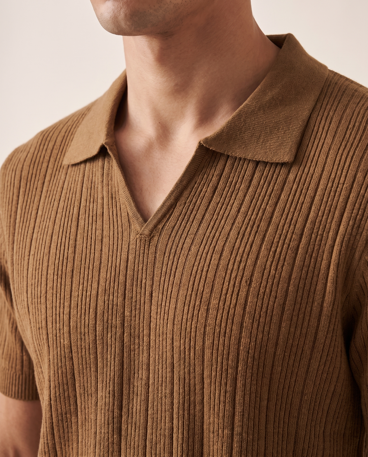 Close-up of the open buttonless collar on The Henley