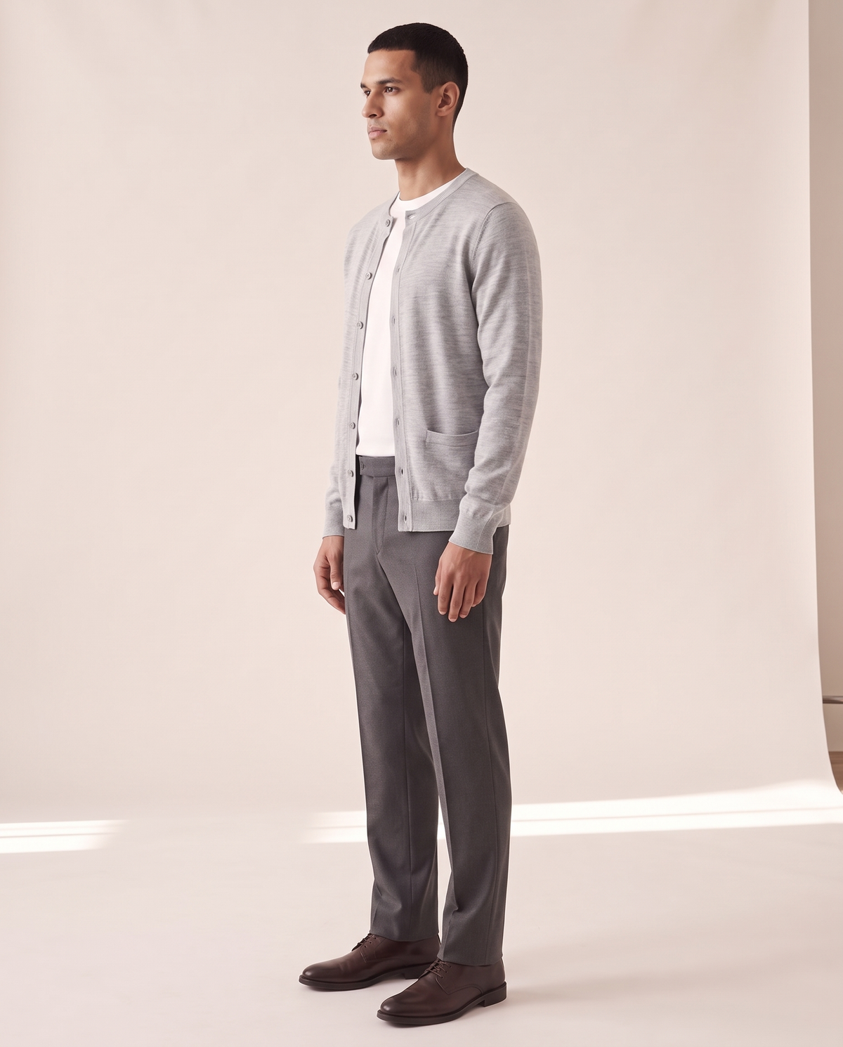 The Wendover merino button cardigan shown in side profile