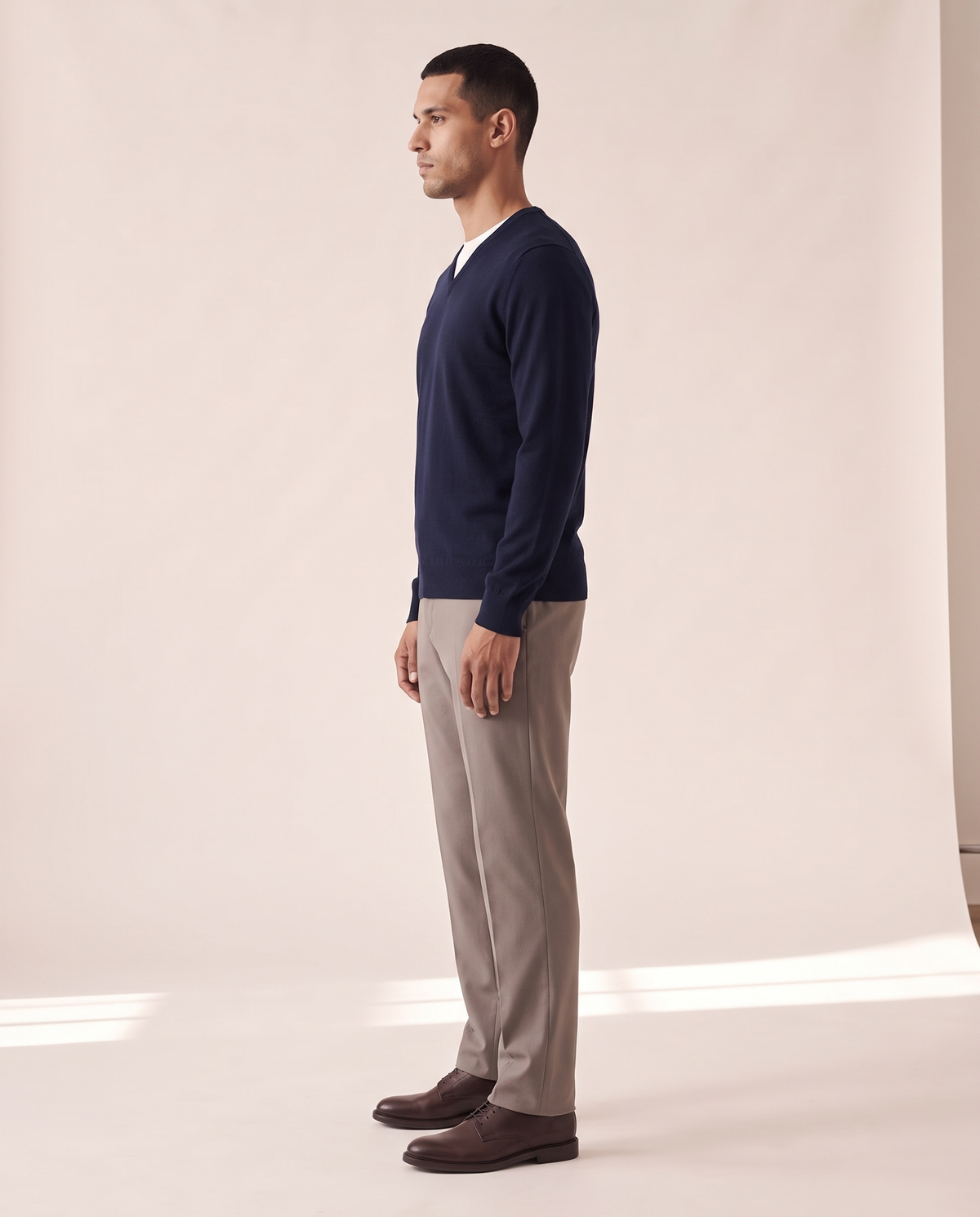 The Sandringham merino V-neck jumper shown in side profile