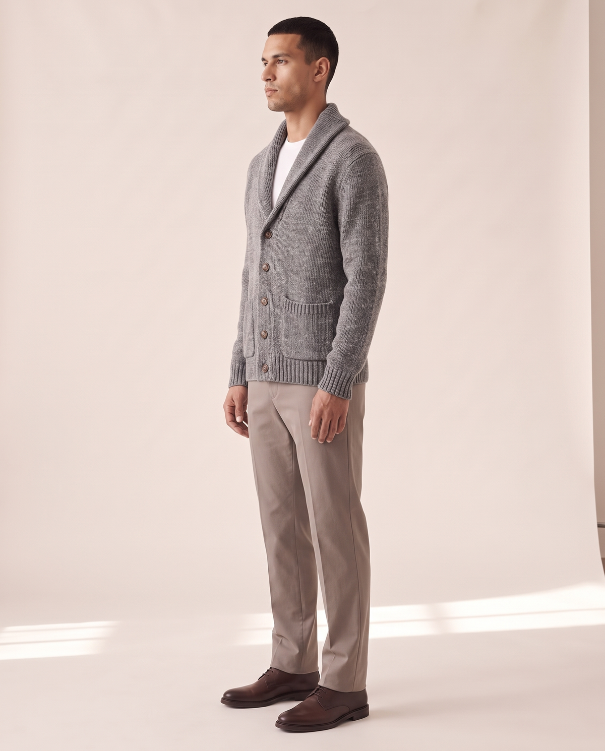 The Thornbury cashmere shawl-collar cardigan shown in side profile