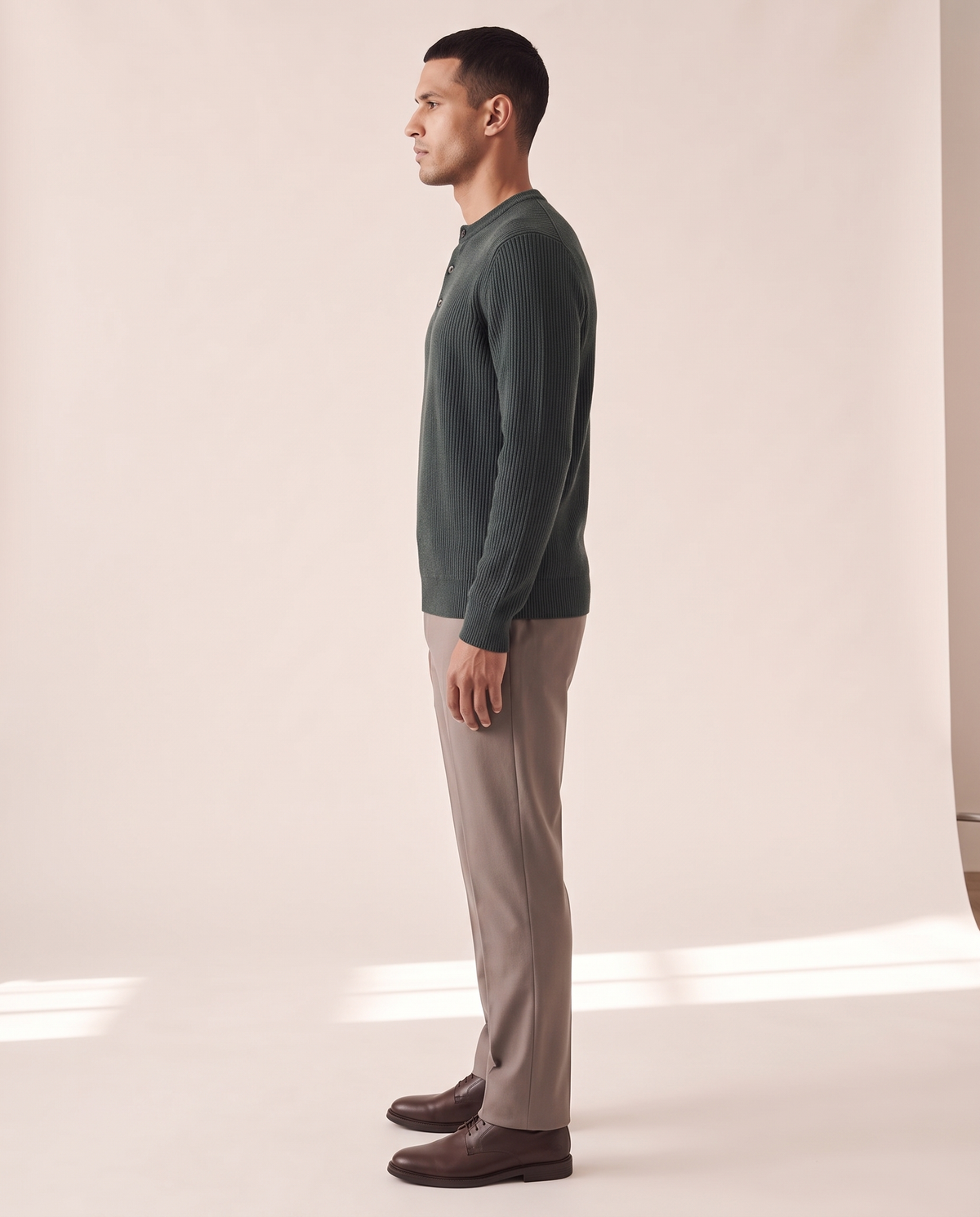 The Alderley merino ribbed henley shown in side profile