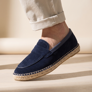 Close-up of The Tarrant worn, low three-quarter on the penny strap and braided jute rope sole