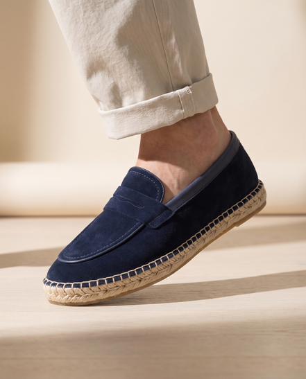 Close-up of The Tarrant worn, low three-quarter on the penny strap and braided jute rope sole