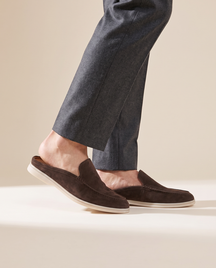Close-up of The Sloane worn, side profile showing the open back of the mule and the cream sole edge