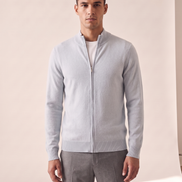 Model wearing the light blue merino zip cardigan, front view