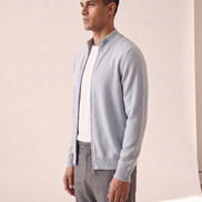 Model wearing the light blue merino zip cardigan, side profile