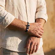 The Hythe Anchor Cord Bracelet worn with rolled linen