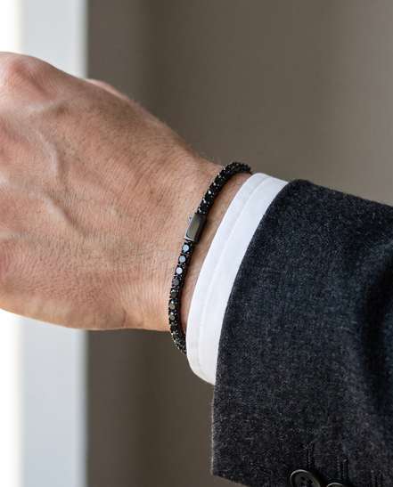 The Onslow Black Stone Tennis Bracelet under a shirt cuff