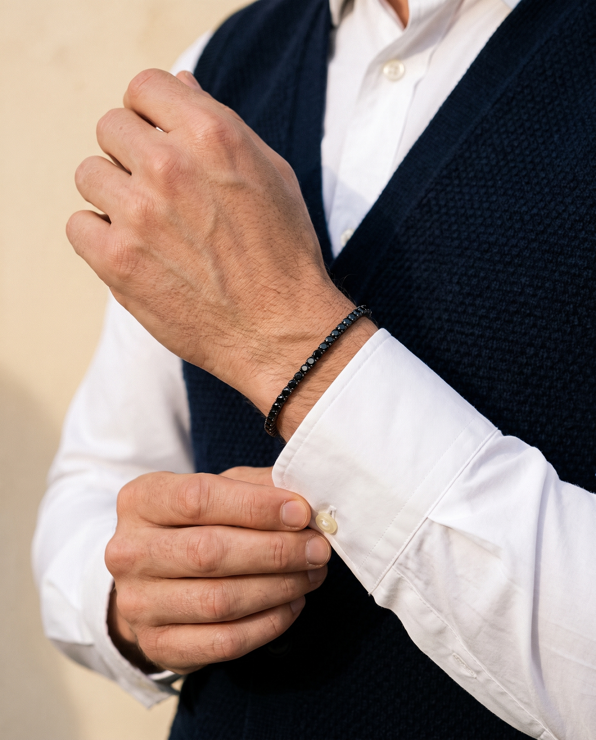 The Onslow Black Stone Tennis Bracelet worn with a knitted waistcoat