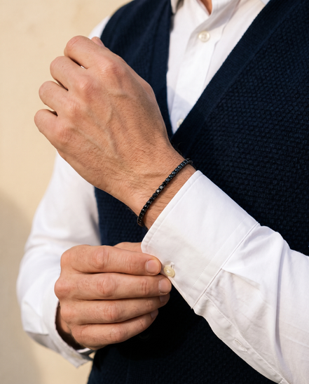 The Onslow Black Stone Tennis Bracelet worn with a knitted waistcoat