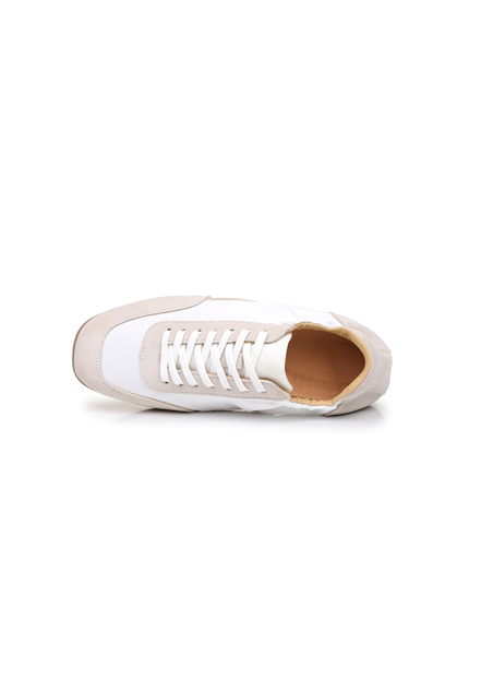The Petersham trainer in ivory, angled from above